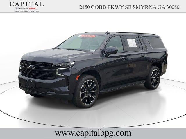 2024 Chevrolet Suburban RST in Dark Ash Metallic — front three-quarter view